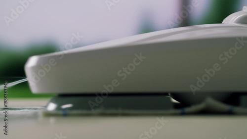 Vacuum cleaner close up. Woman is vacuuming floor of modern apartment living room, using portable cordless vacuum cleaner. Daily routine and household chores