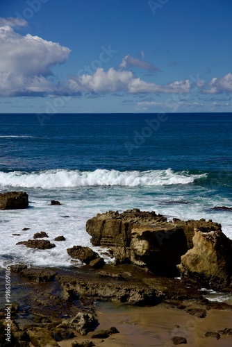 split rock formation along the coast