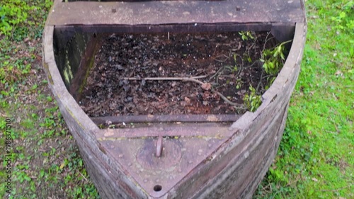 Rustic wooden boat repurposed as garden planter