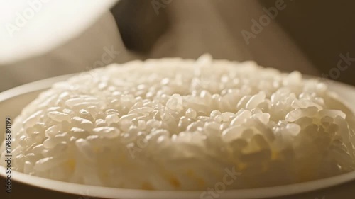 Close up of steaming white rice in a bowl