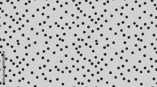 Abstract polka dot pattern on light gray background with scattered specks.