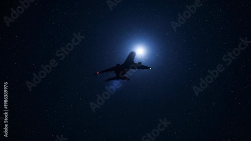 Night Flight Silhouette: An airplane soars through the dark expanse of the night sky, illuminated by a radiant light source, creating a stark and captivating silhouette.