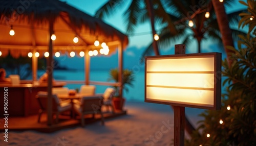 Tropical beach restaurant at dusk with blank sign and copy space
