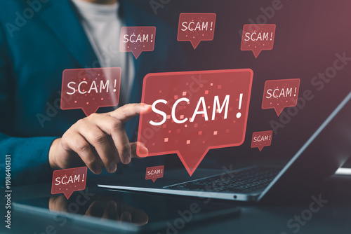 Bild auf Leinwand Online scam and internet fraud concept with scammer using laptop, representing malicious posts, fraudulent ads on social media, cybersecurity threats, and digital risk awareness