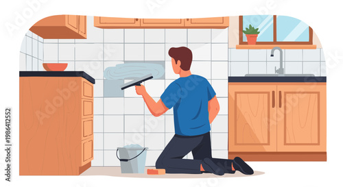 Man applying grout to white kitchen tiles during home renovation project