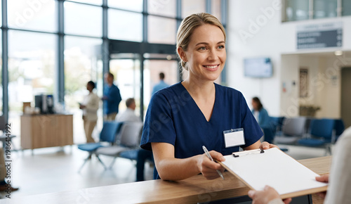 Professional receptionist showing empathy and kindness at a hospital front desk with natural lighting.