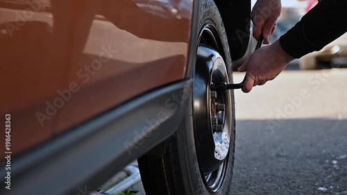 Replacing a Car Wheel Using a Jack