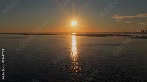 Sun at seascape horizon. Sunset cityscape of Miami. Miami cityscape. City at sea coast aerial view. Cityscape horizon with evening sun. Sunset city of Miami. Sunrise skyline aerial view