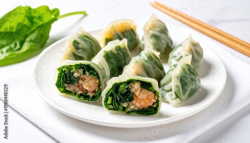 Delicate crystal dumplings with vibrant green spinach wrappers encasing finely minced shrimp filling on a white plate