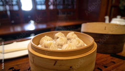 Delicate Steamed Xiao Long Bao Dumplings with Broth in Bamboo Steamer