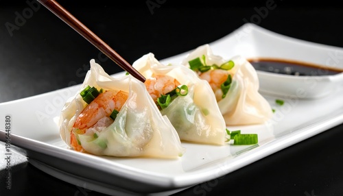 Delicate crystal dumplings filled with vibrant green chives and succulent shrimp, ready to be enjoyed.