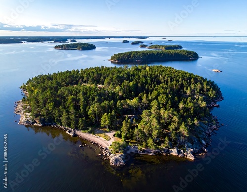 Aerial view of a serene island with lush greenery surrounded by calm waters