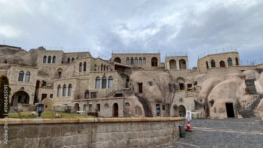 Fototapeta premium Cappadocia cave hotel exterior daytime Turkey stone architecture travel destination