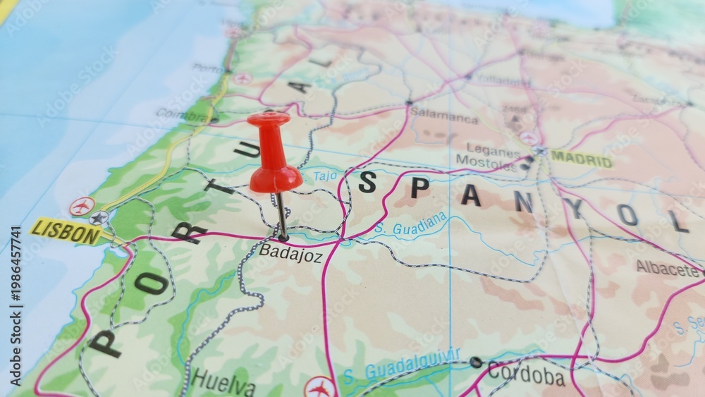 Obraz premium View of Badajoz, is the capital of the province of Badajoz in the autonomous community of Extremadura, Spain, on a geographical map of Europa, marked with red push pin