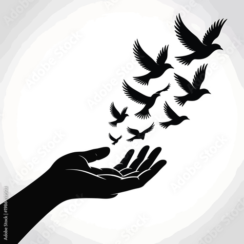 A hand releasing several birds into flight against a blurred backdrop