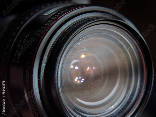 Close-Up Image of a Vintage Camera Lens with Reflections