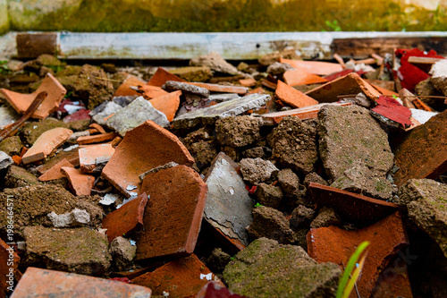 Close up of pile of broken tiles and concrete