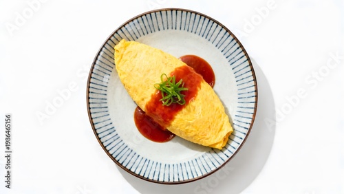Top view of omurice neatly plated on a Japanese style plate with minimal garnish