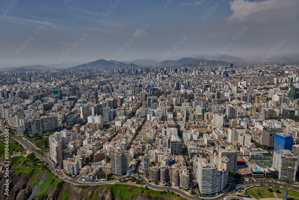 Fototapeta premium Aerial view of Miraflores and Costa Verde coastline in Lima, Peru, showcasing modern urban living along the Pacific Ocean with scenic cliffs, vibrant cityscape, and coastal landscapes. 