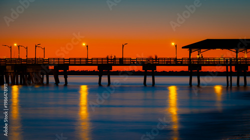 Bild auf Leinwand St. Simons Island Pier at Dusk with Warm Glow