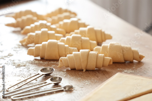 Raw croissants with dough a...