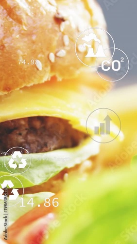 Vertical video: Camera panning right, zooming up, burger sharpening while icons showing eco impact
