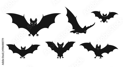 A collection of black bat silhouettes in various flying poses, perfect for Halloween or spooky themes