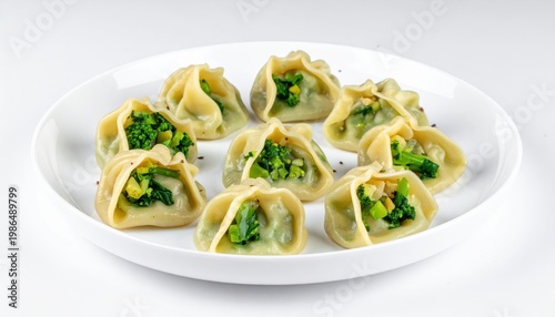 Steamed Vegetable Dumplings, Intricately Folded and Filled with Vibrant Greens, Presented on a White Plate.