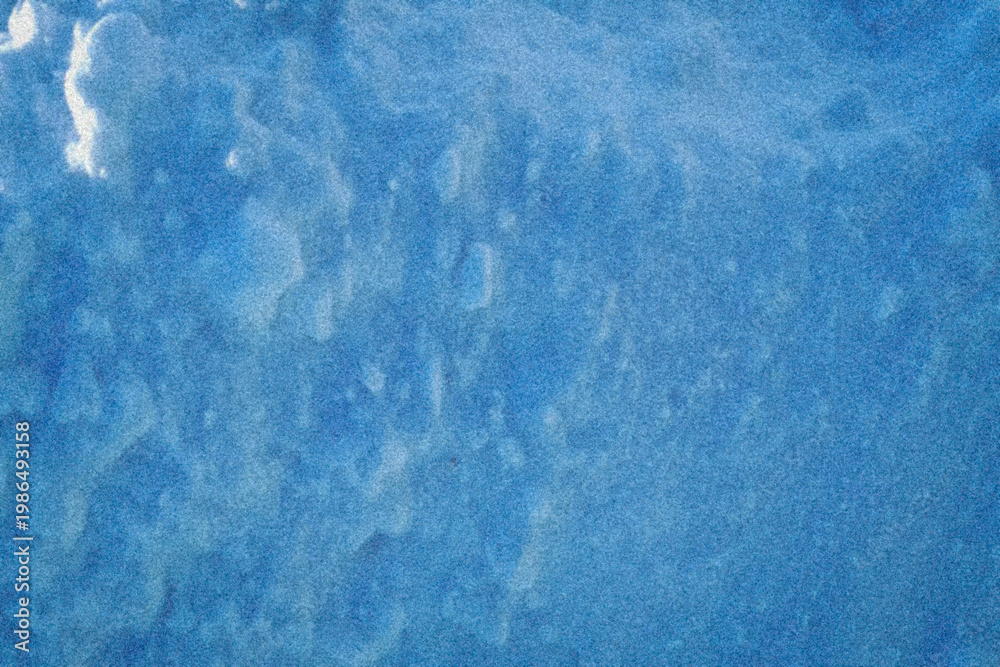 Obraz premium Rich blue tones with organic, waterlike patterns create a dynamic abstract texture that evokes ocean depth, ideal for creative design projects, covers, or digital art.