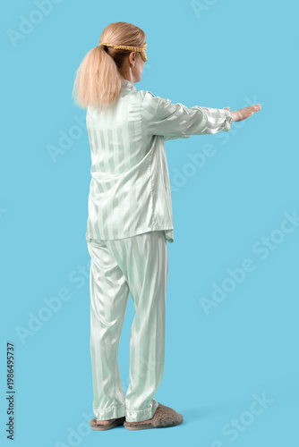 Female sleepwalker in pajam...