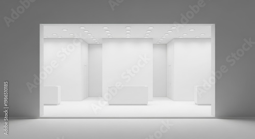A clean, empty, and modern white exhibition stand or retail display area with spotlights.