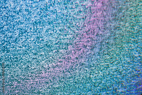 CRT television static noise with blue and pink phosphor glitch texture close-up