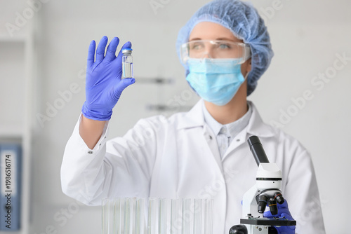 Female scientist with ampou...