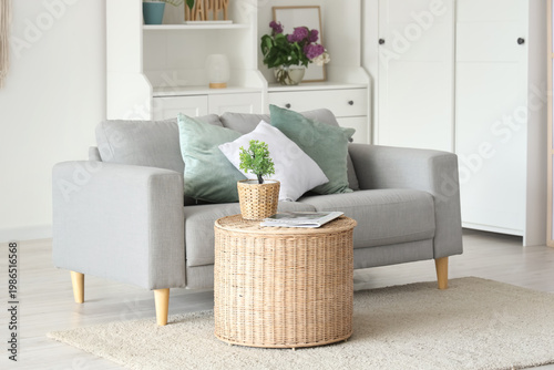 Sofa and wicker coffee tabl...