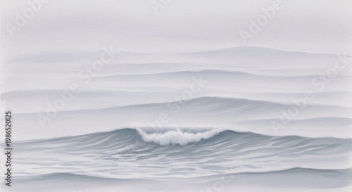 Serene wave breaking against a misty horizon