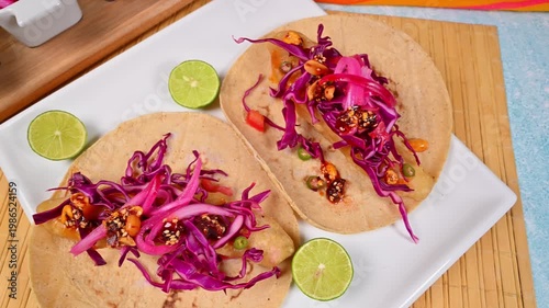 Aerial view of gourmet Mexican seafood tacos with fresh toppings and corn tortillas