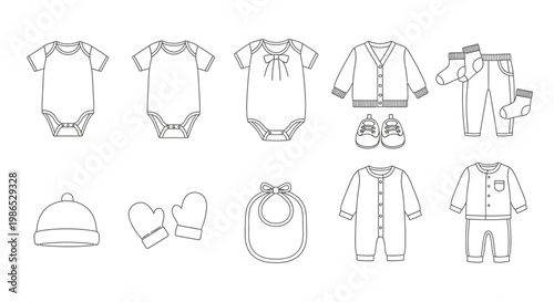Baby clothes and accessories laid out.
