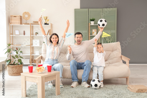 Happy family with soccer ba...