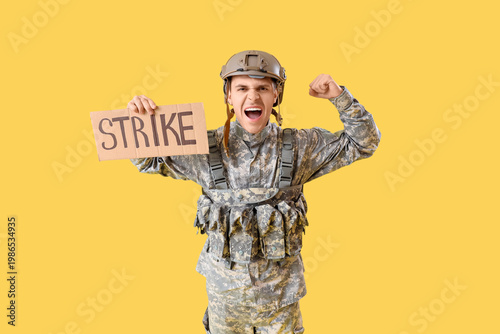 Protesting male soldier hol...
