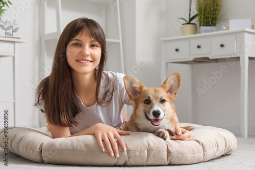 Pretty young woman lying on...