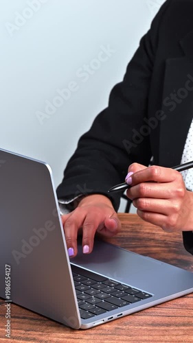 The hands of a businesswoman using digital tools and a state-of-the-art laptop