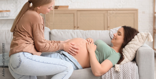 Young happy pregnant woman ...