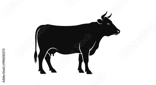 Black silhouette of a cow standing.