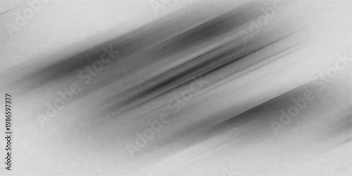 A textured grey silver backdrop featuring black and white paper with black ink splashes and snow on a brushed metallic stainless steel surface