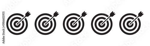 Business goal target icons with arrows hitting bullseye representing successful strategy and marketing achievement.