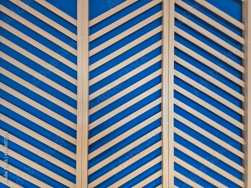 Abstract geometric wooden slats on blue background, modern pattern, clean lines, minimalist design texture