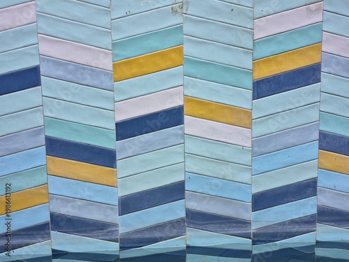 Seamless geometric tile pattern in blue and yellow tones, modern abstract background, clean repeating design