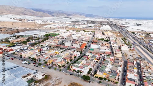 town drone urban rural city building house modern home plastic sea intensive farming industry development agriculture greenhouse invernaderos - Andalusia, Spain - 2025