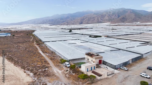 plastic sea drone agriculture greenhouse field intensive farming invernaderos roof texture architecture structure building mountain landscape - Andalusia, Spain - 2025