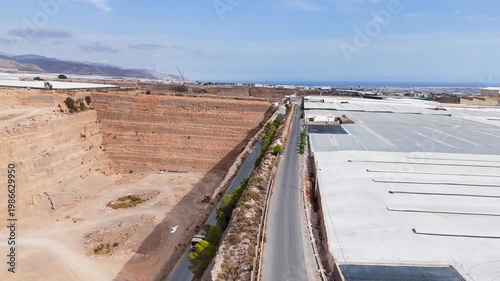 mine dig deep road industrial mining way business earth terra forming transformation success drone travel plastic sea agriculture greenhouse invernaderos intensive farming - Andalusia, Spain - 2025